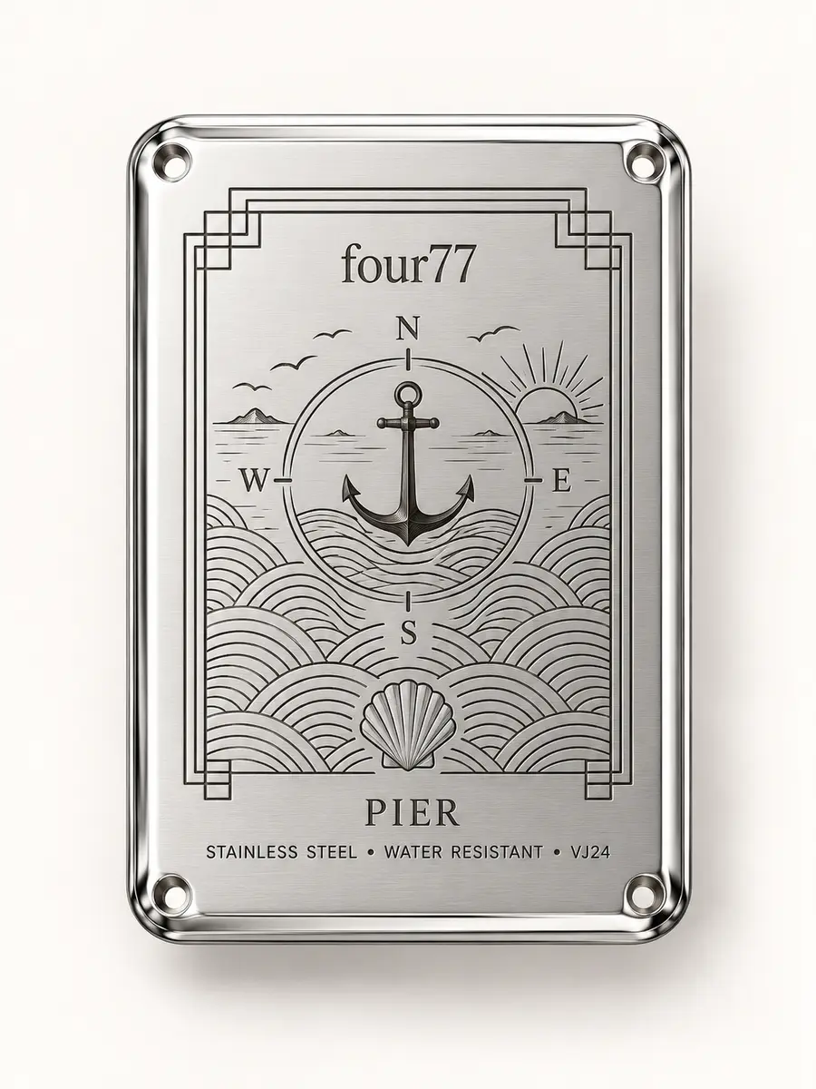Pier caseback engraving with anchor, compass, horizon, waves, and shell